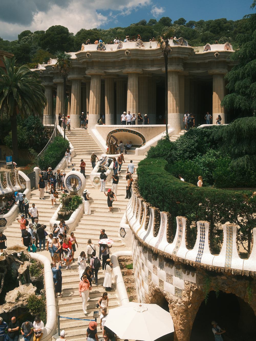 Visitors on the mosaic staircase of Park Güell, Barcelona