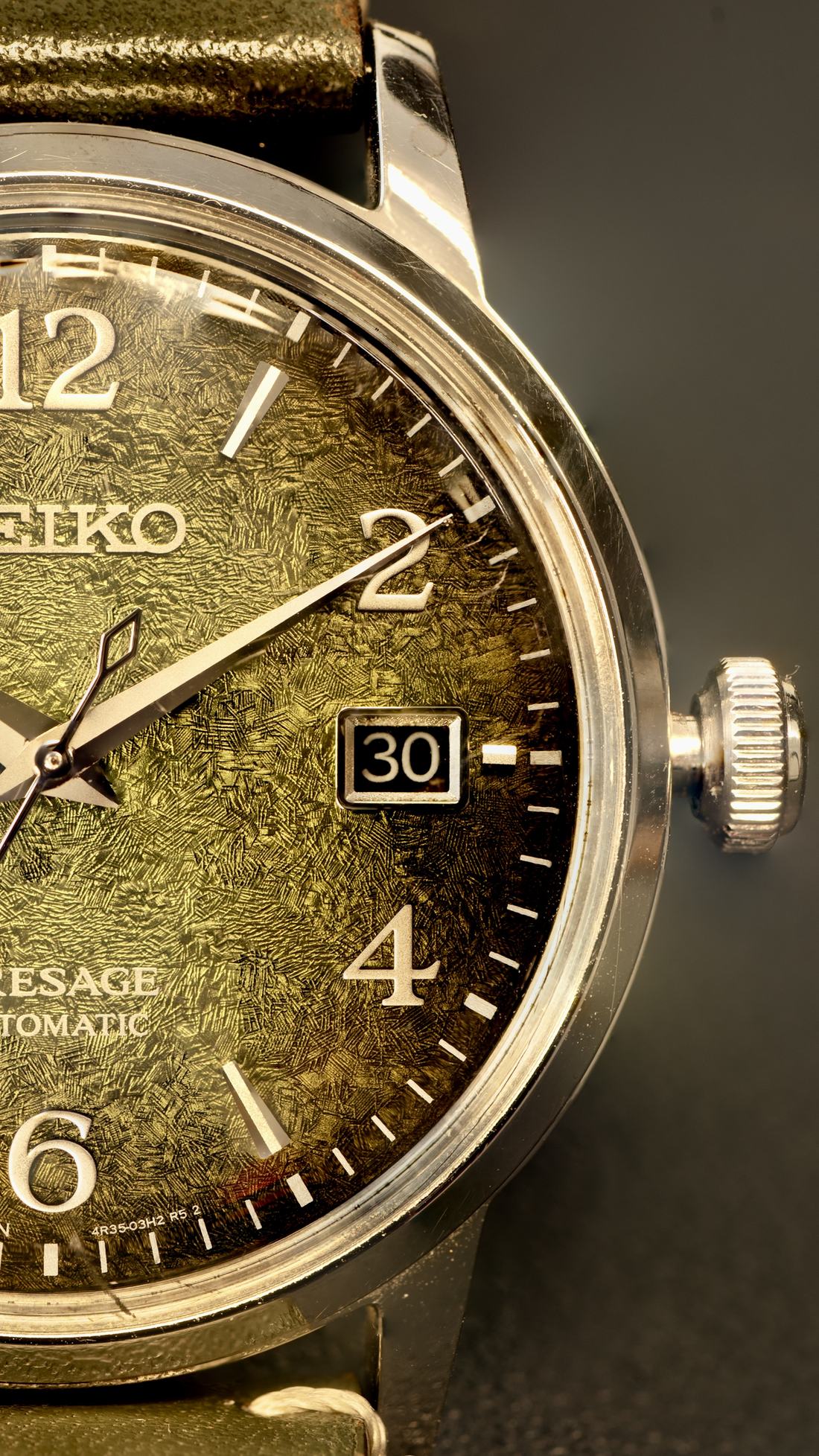 Macro shot of a Seiko Presage with a textured green Matcha dial